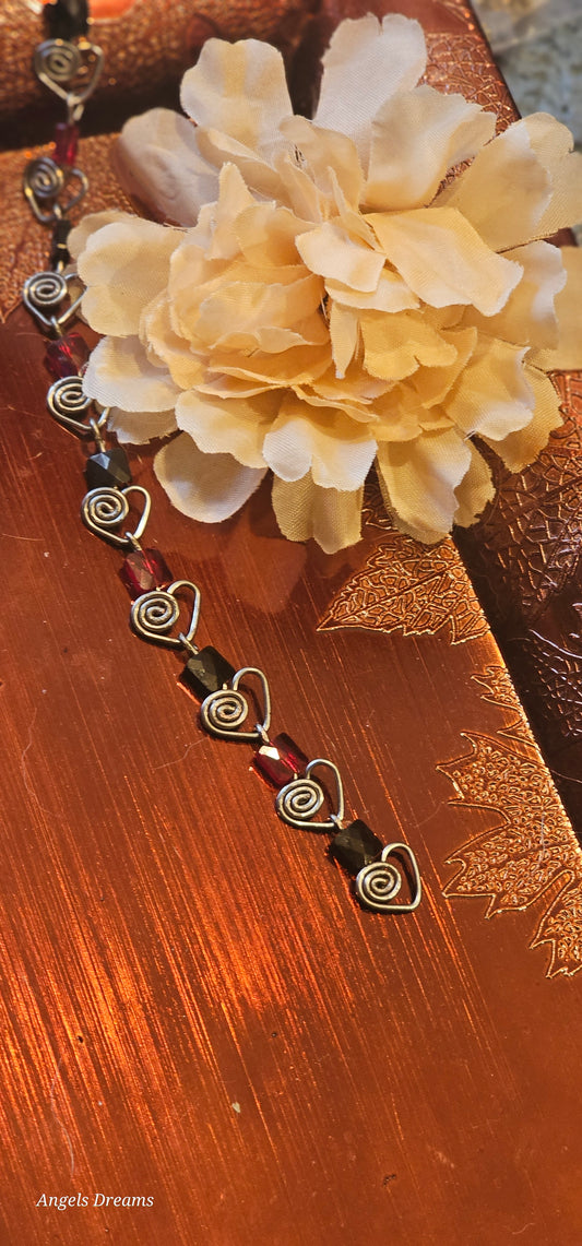 Hematite heart chain with red and black swarovski square crystals.